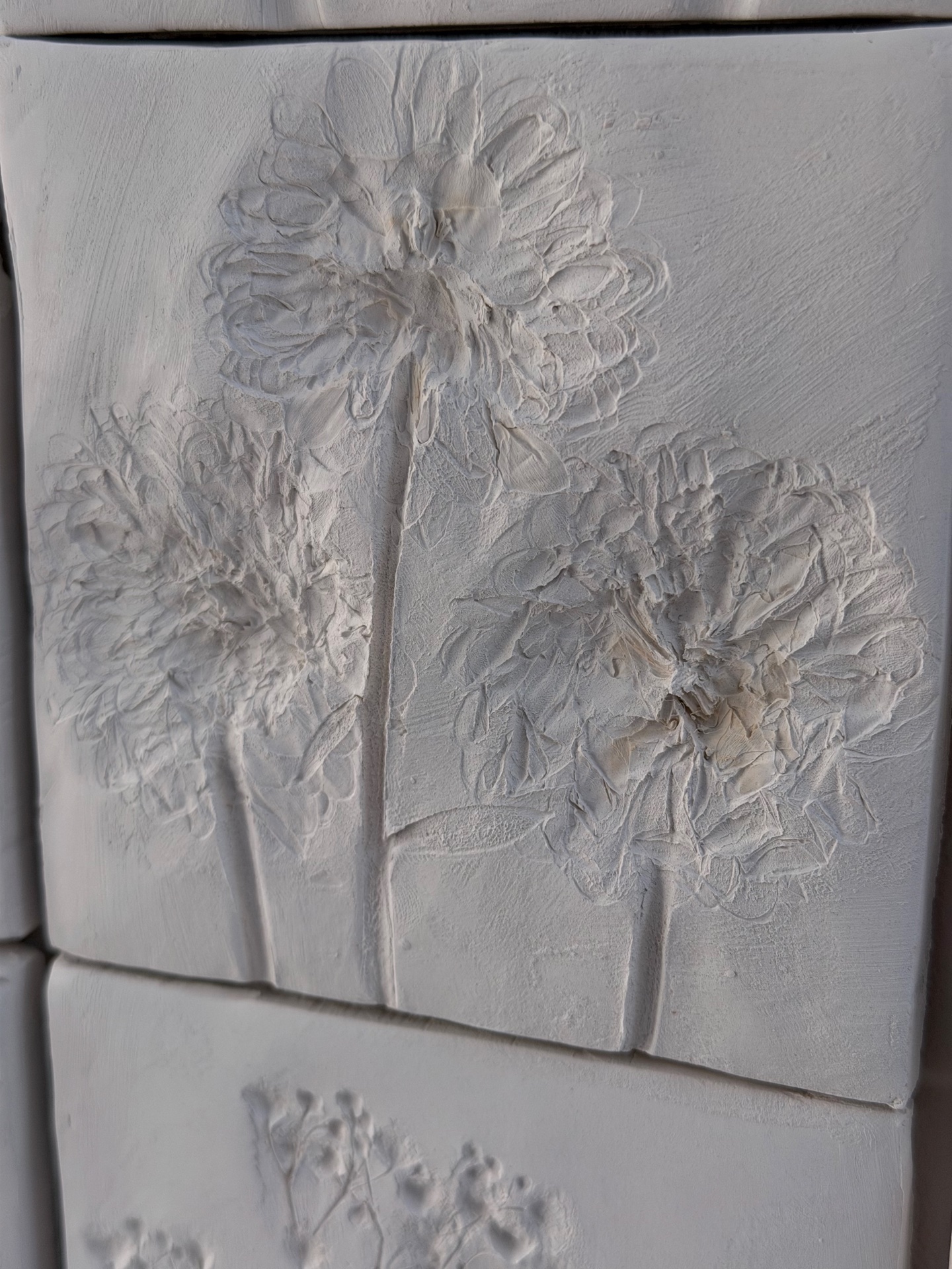 In Memoriam — ceramic tile close-up